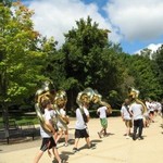 Sousaphone section marches down the path